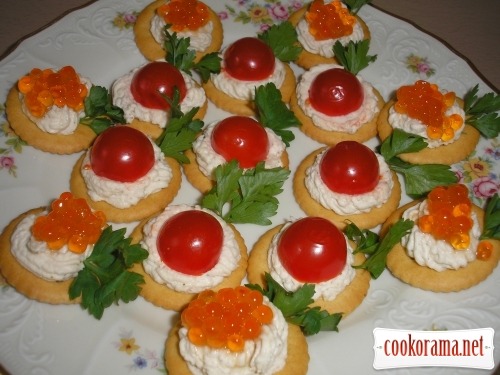 Canapes with cherry tomatoes and caviar