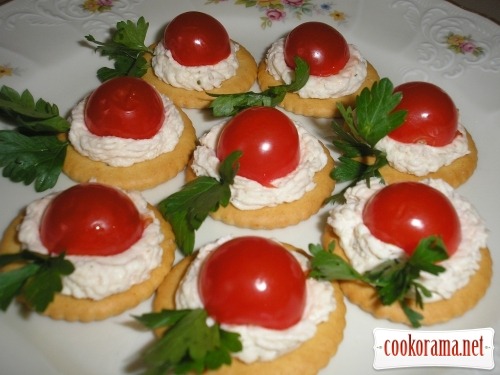 Canapes with cherry tomatoes and caviar